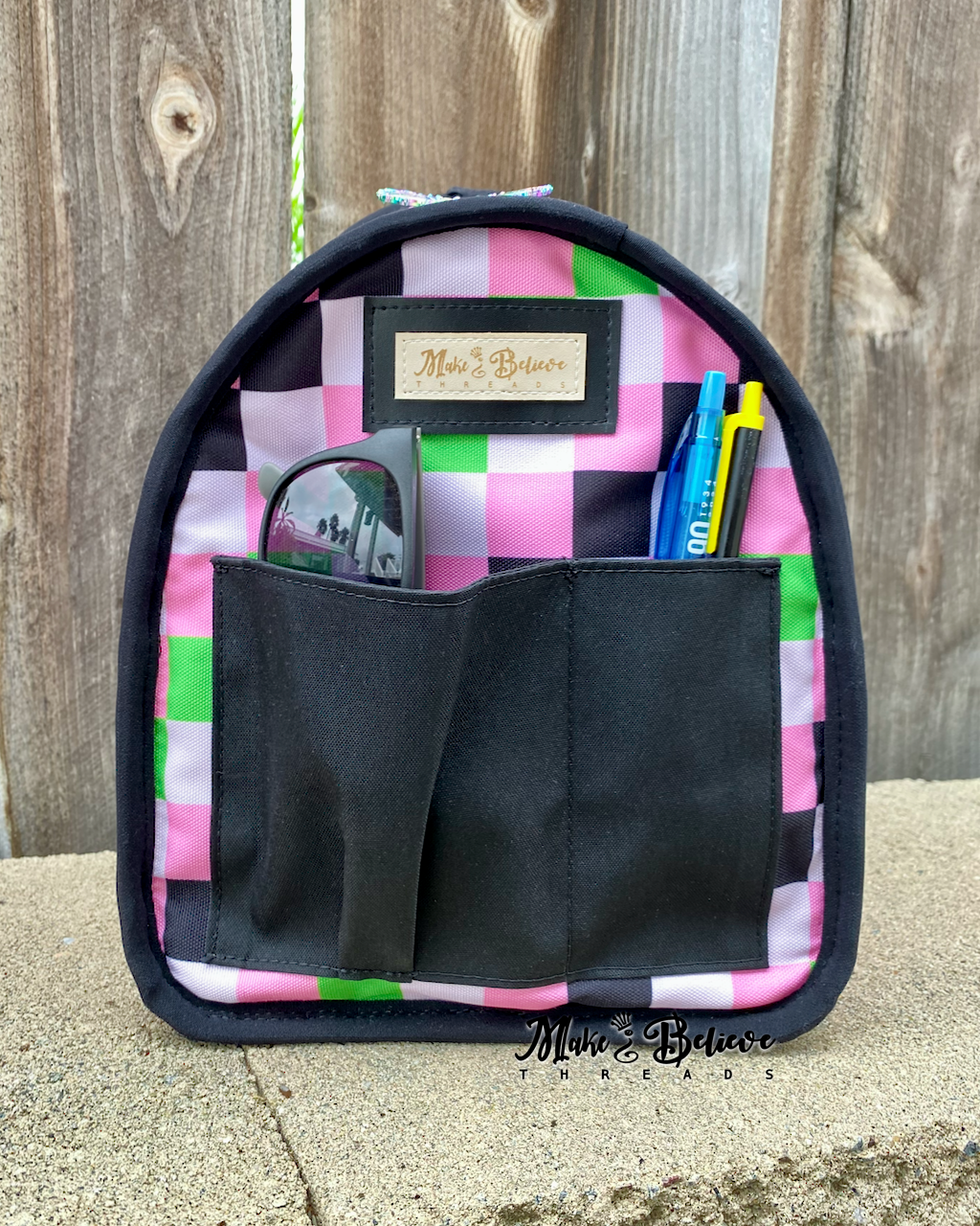 Black Wicked Backpack with Custom Green and Pink Zippered Textile