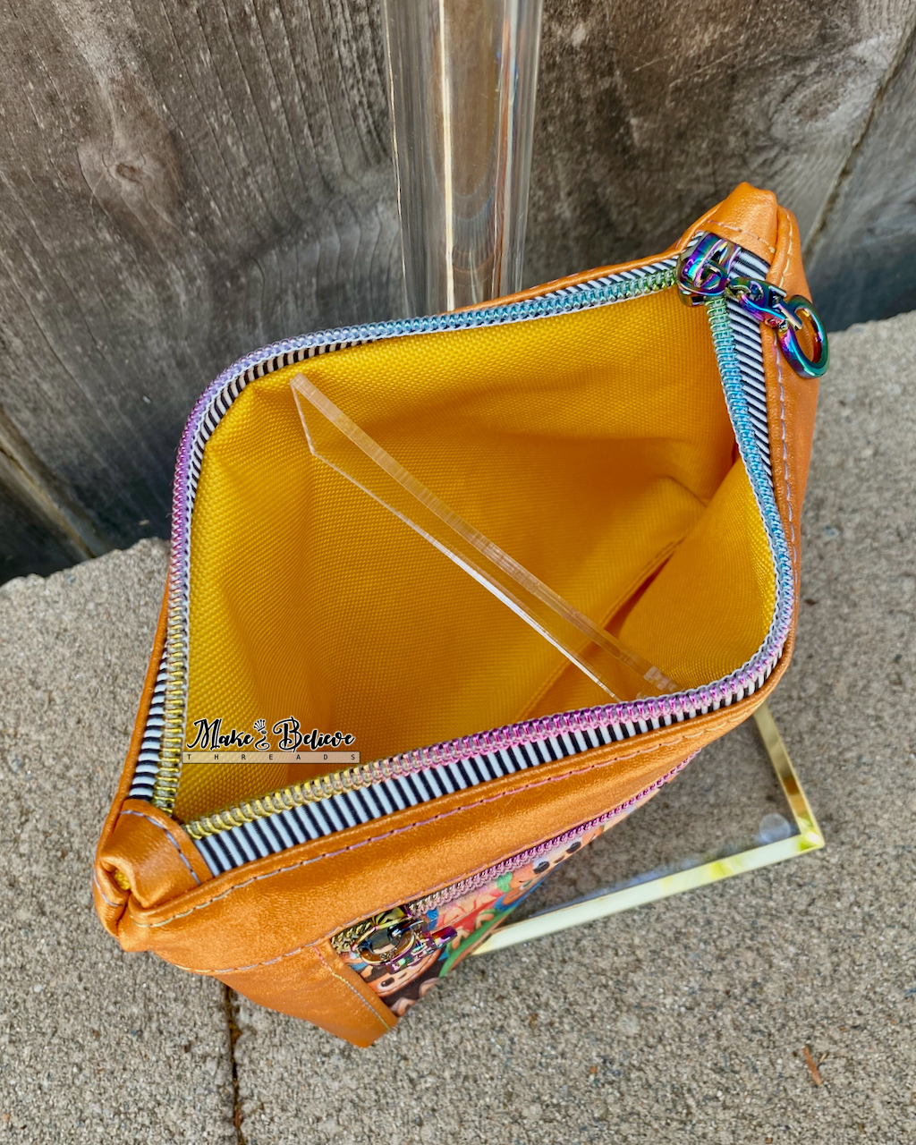 Little Monsters Orange Shimmering Pouch with Wristlet Strap