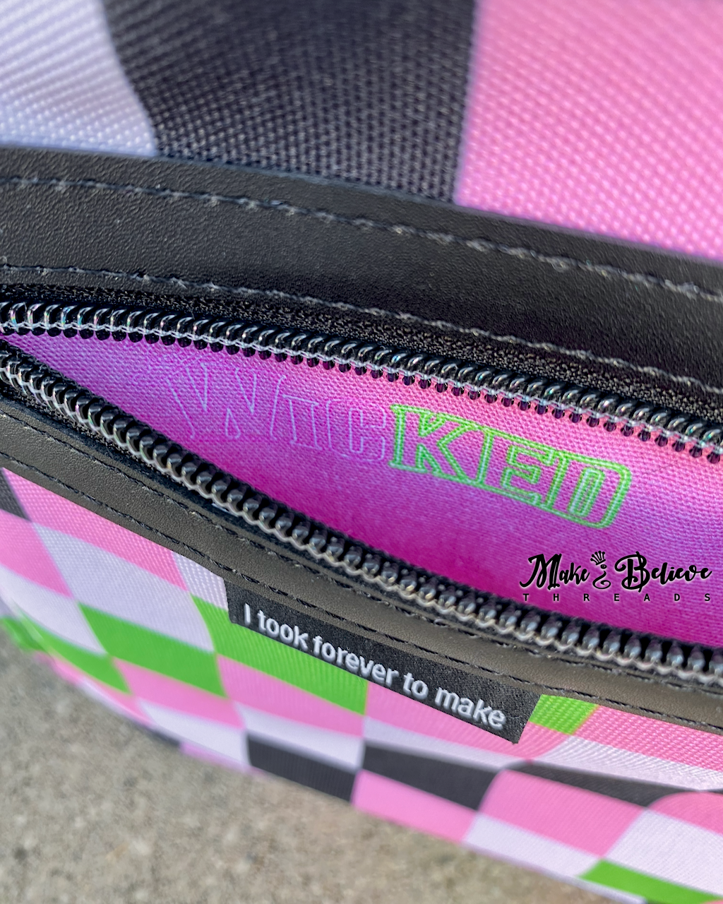 Black Wicked Backpack with Custom Green and Pink Zippered Textile