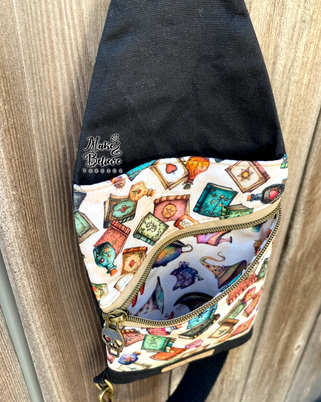 Black and Tan Tossed Witchy Books Mini Traveler Sling