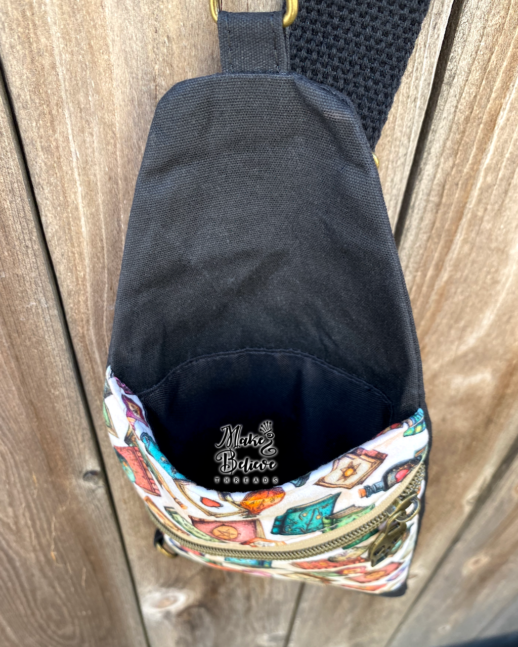 Black and Tan Tossed Witchy Books Mini Traveler Sling
