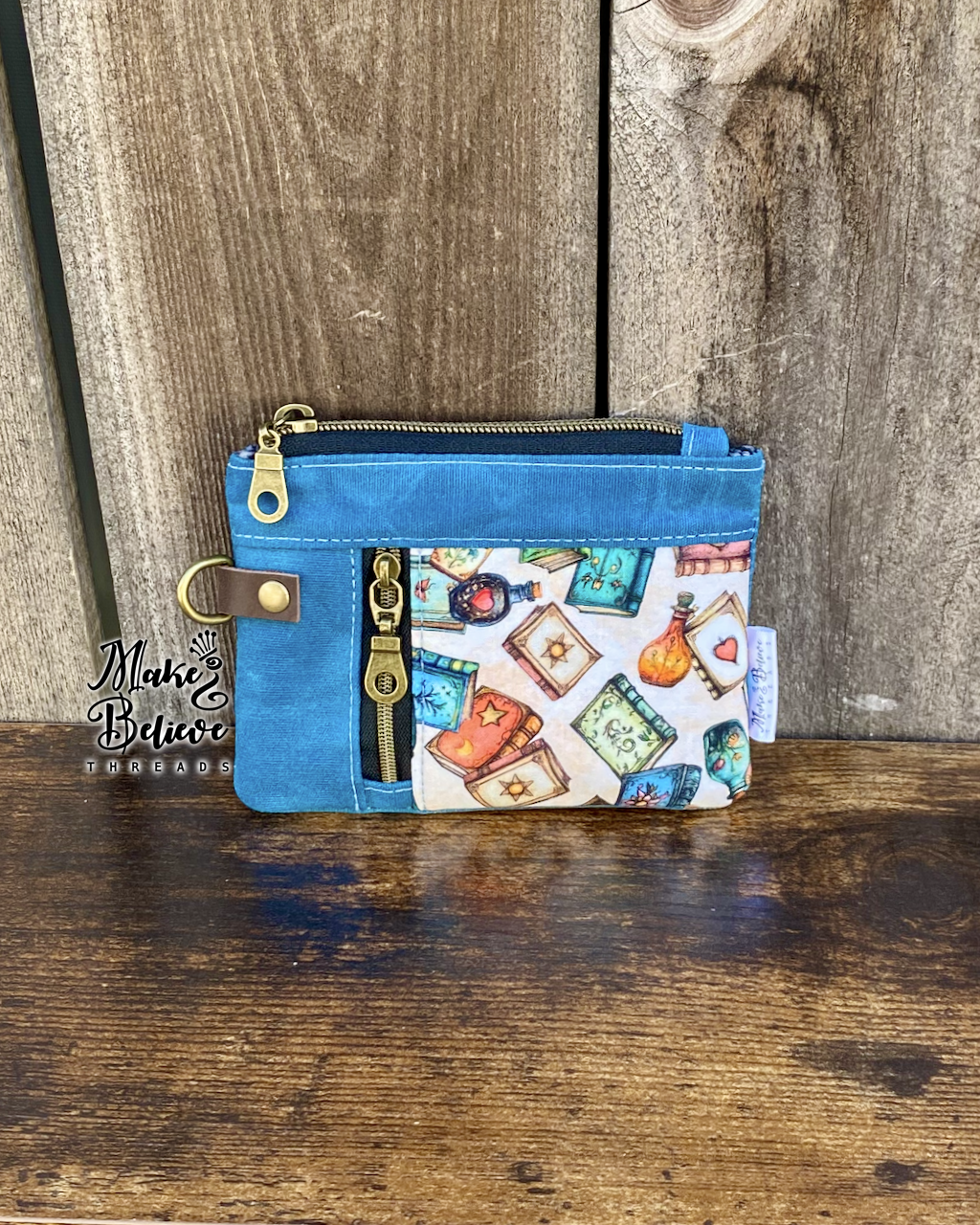 Blue Waxed Canvas Tossed Witchy Books Mini Zip Wallet