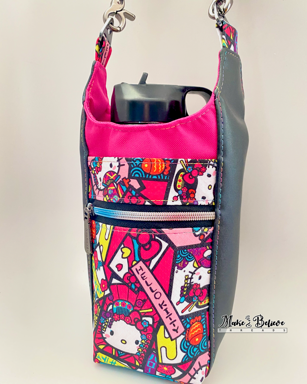 Colorful water bottle carrier with "Bow Kitty" design on a plain background
