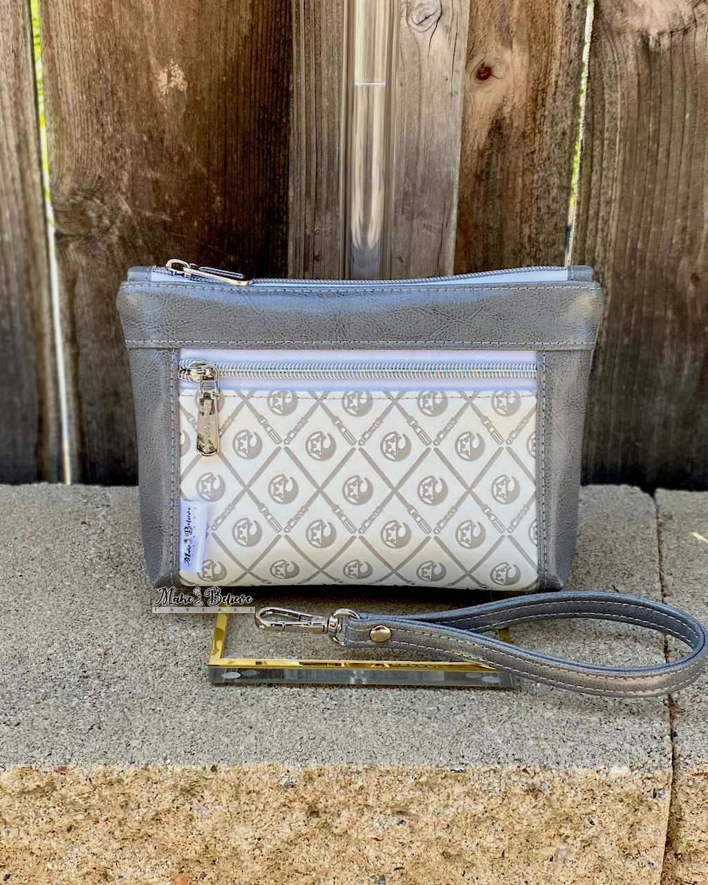 Debossed Space Wars Grey and White Pouch with Wristlet Strap
