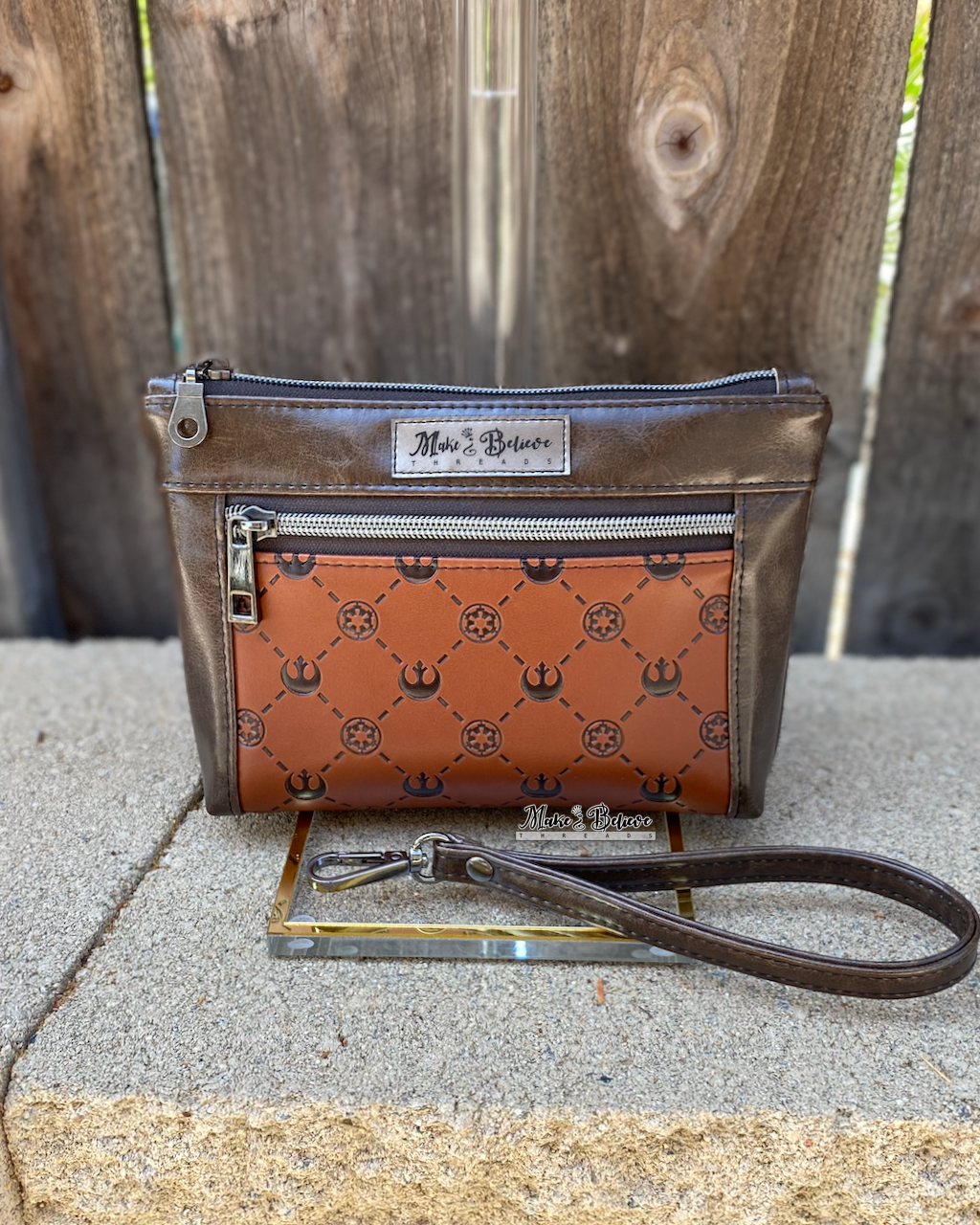 Debossed Space Wars Saddle Brown Pouch with Wristlet Strap