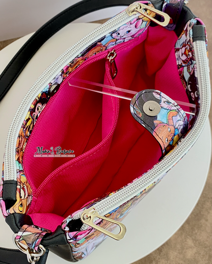 Top view of open bag revealing gusset snap closure with pink interior and zipper pocket on a white background