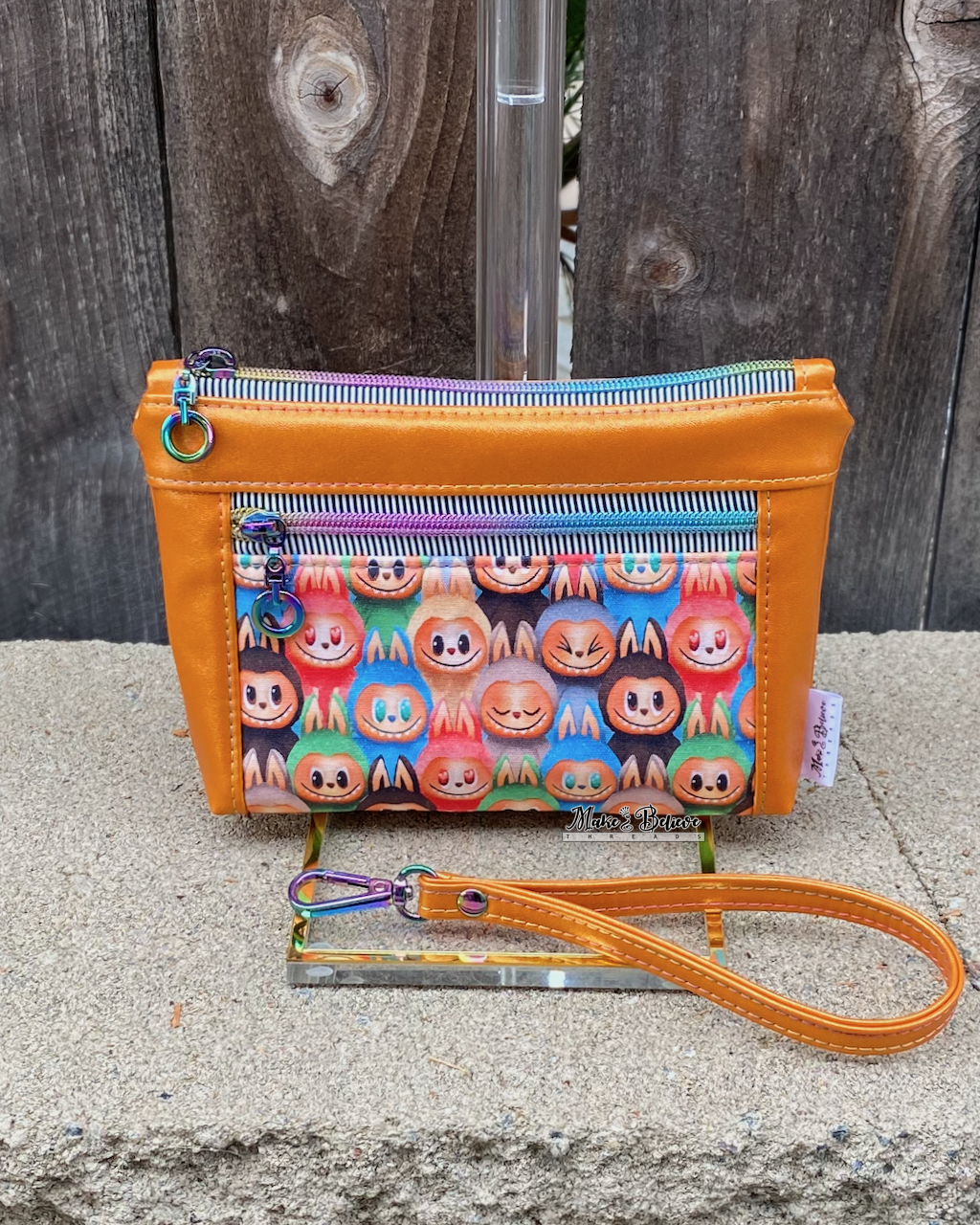 Little Monsters Orange Shimmering Pouch with Wristlet Strap