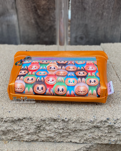 Little Monsters Orange Shimmering Pouch with Wristlet Strap