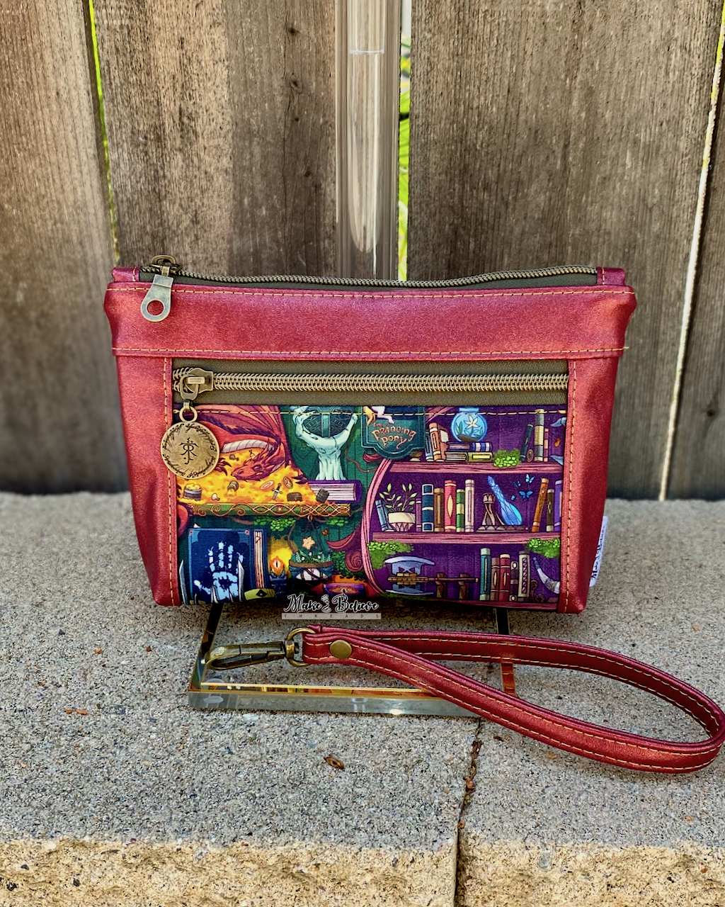 One Ring Bookshelf Shimmering Cranberry Pouch with Wristlet Strap