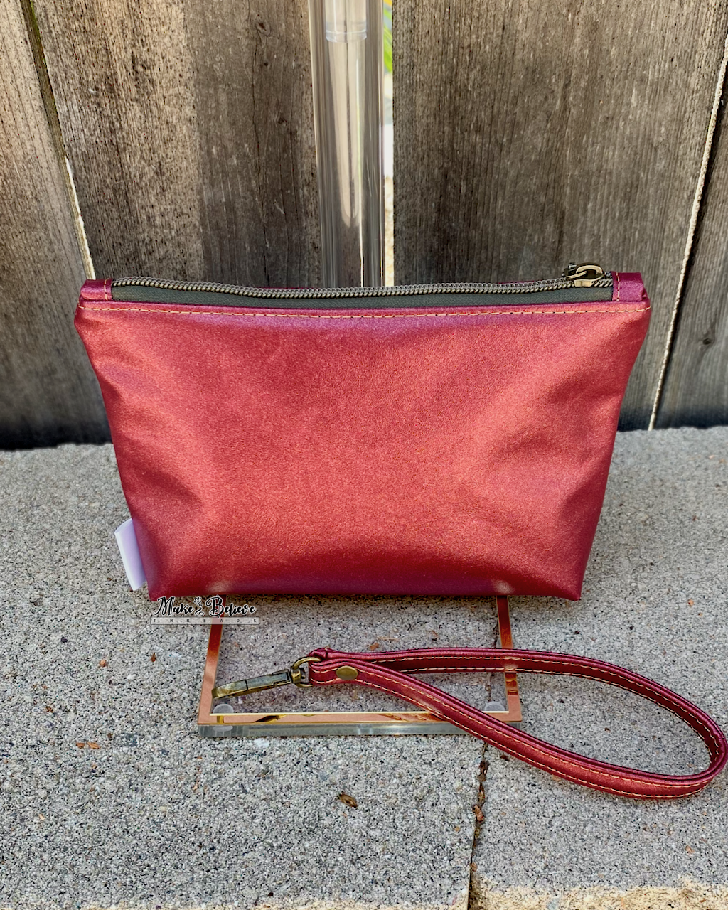 One Ring Bookshelf Shimmering Cranberry Pouch with Wristlet Strap