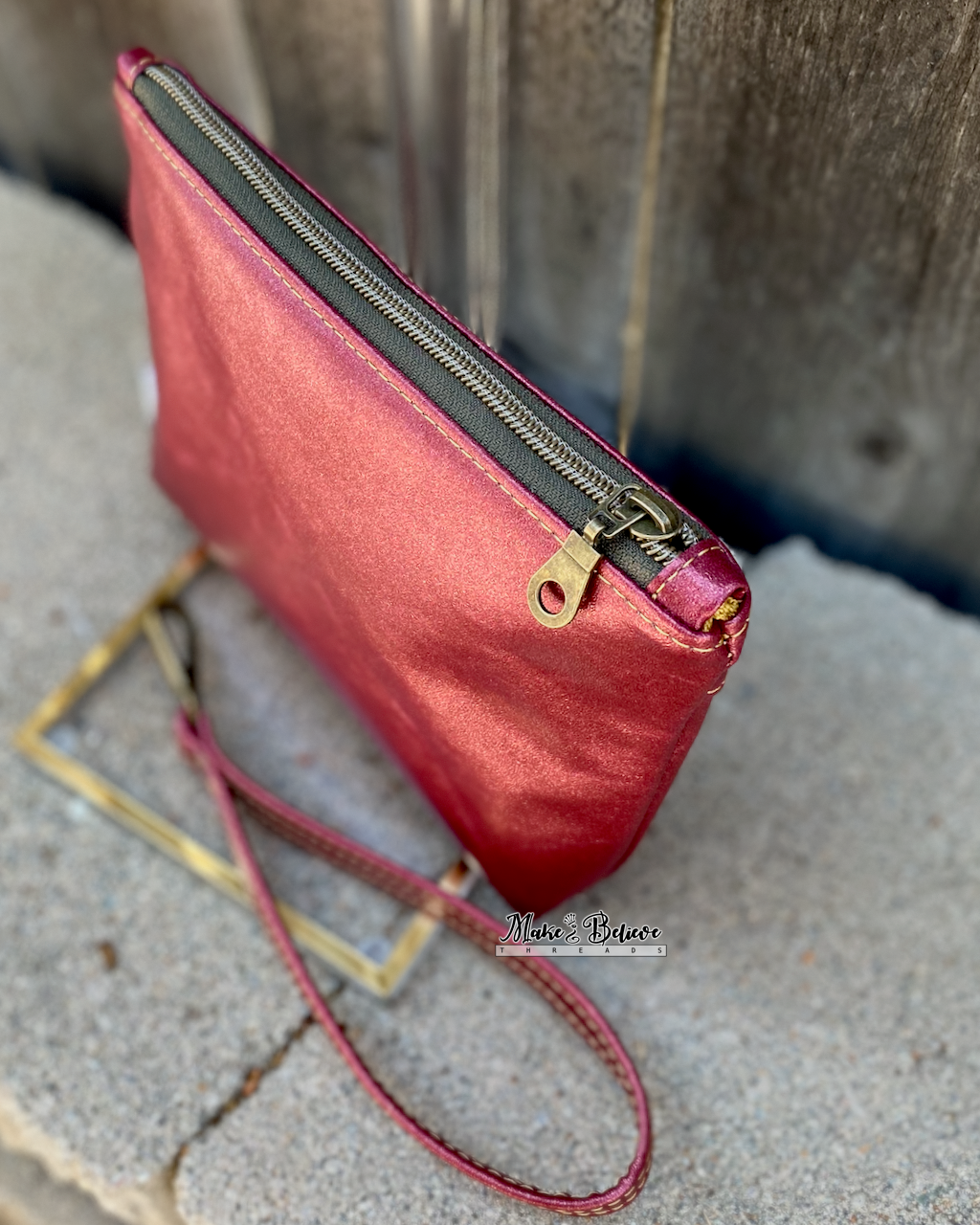 One Ring Bookshelf Shimmering Cranberry Pouch with Wristlet Strap