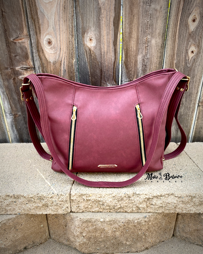 Sleek Bordeaux Convertible Bag with Gold Hardware