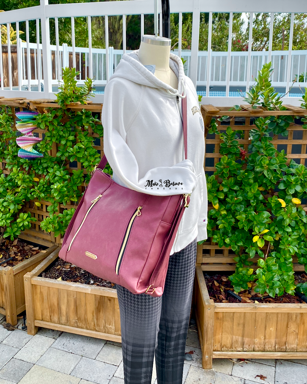 Sleek Bordeaux Convertible Bag with Gold Hardware