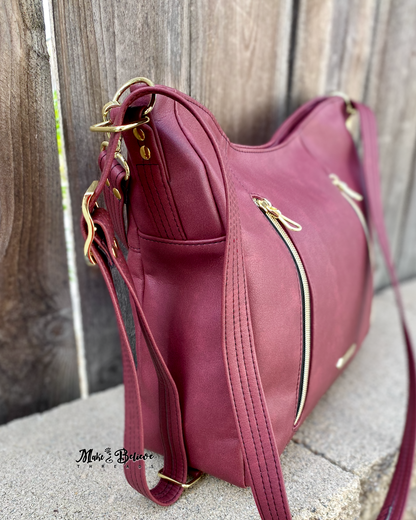 Sleek Bordeaux Convertible Bag with Gold Hardware
