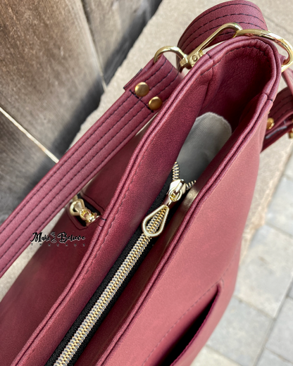 Sleek Bordeaux Convertible Bag with Gold Hardware