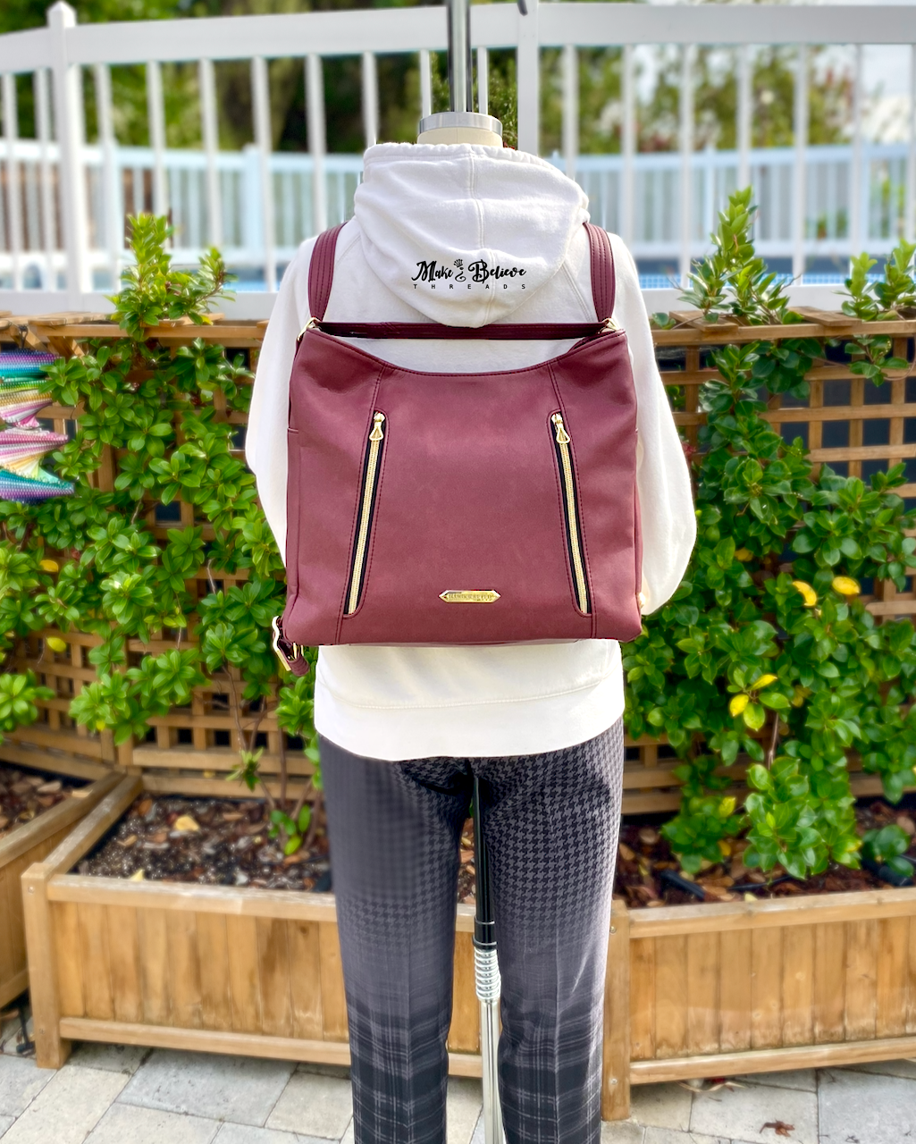 Sleek Bordeaux Convertible Bag with Gold Hardware