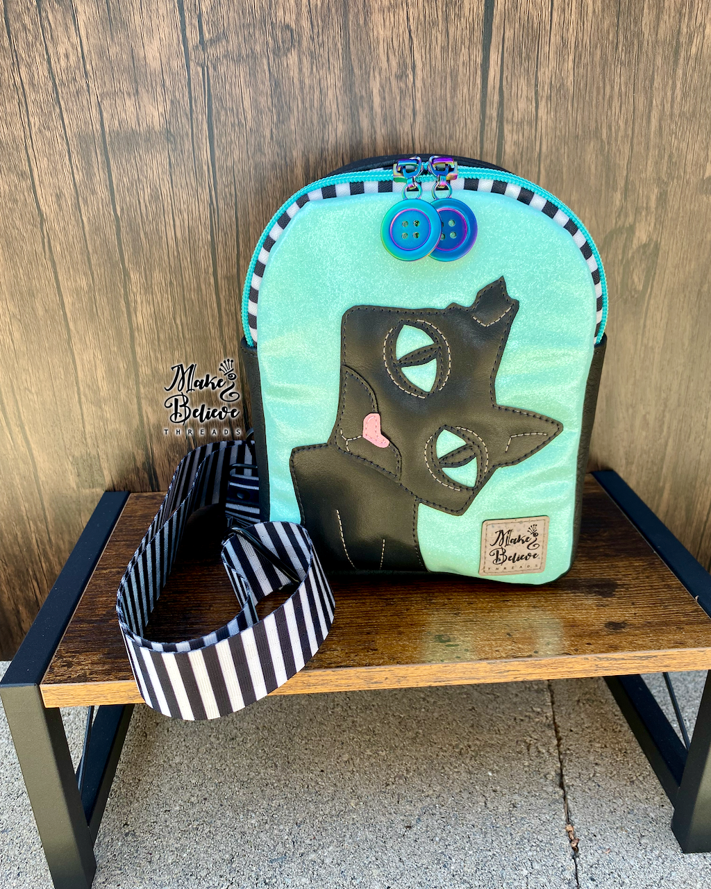 The Cat GITD Mint and Black Mini Crossbody Sling
