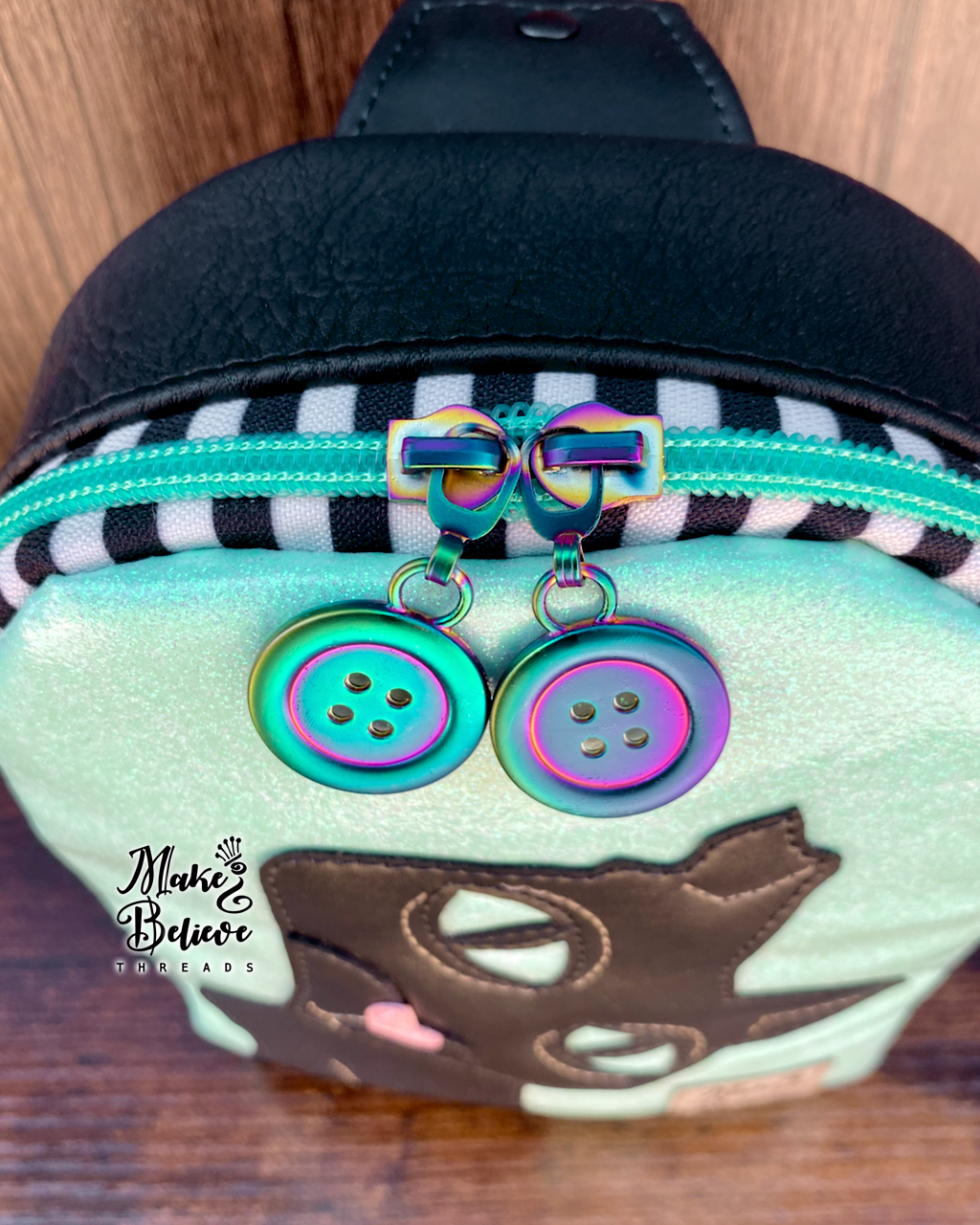 The Cat GITD Mint and Black Mini Crossbody Sling