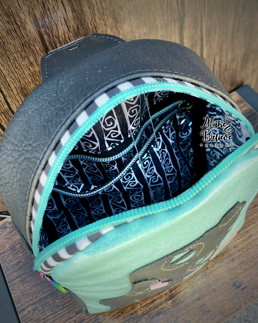 The Cat GITD Mint and Black Mini Crossbody Sling