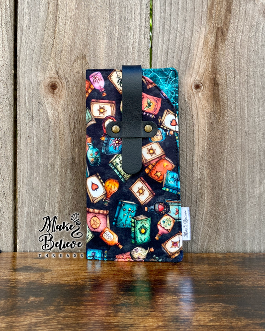Tossed Witchy Books on Black Glasses Sleeve